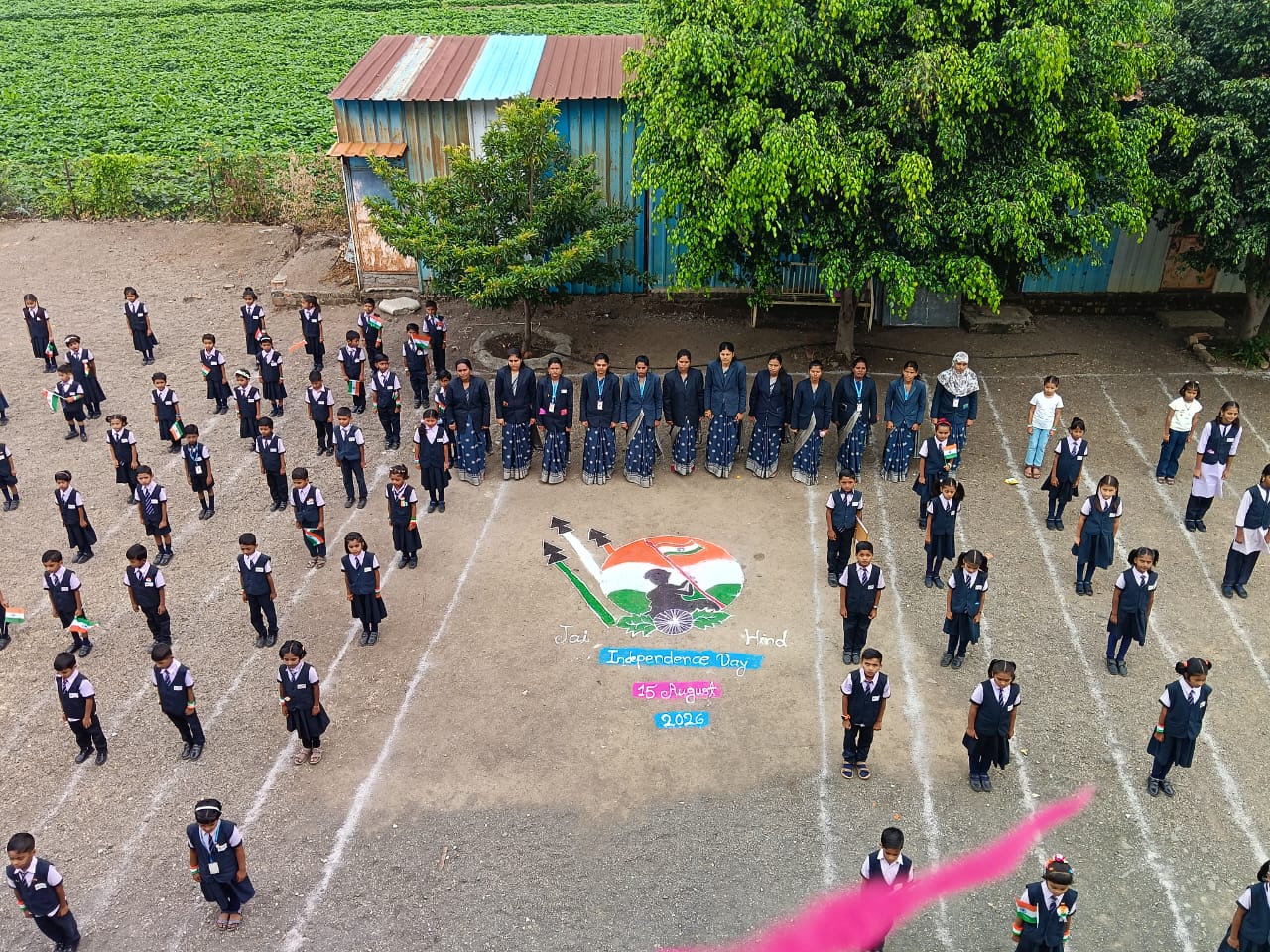 Students and teachers taking part in an outdoor school celebration